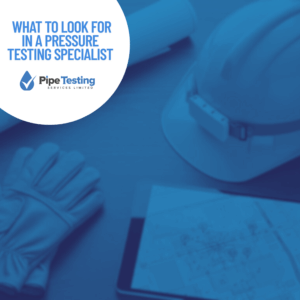 What to look for in a pressure testing specialist, a guide by Pipe Testing Services, over a background of a contractor's planning desk.
